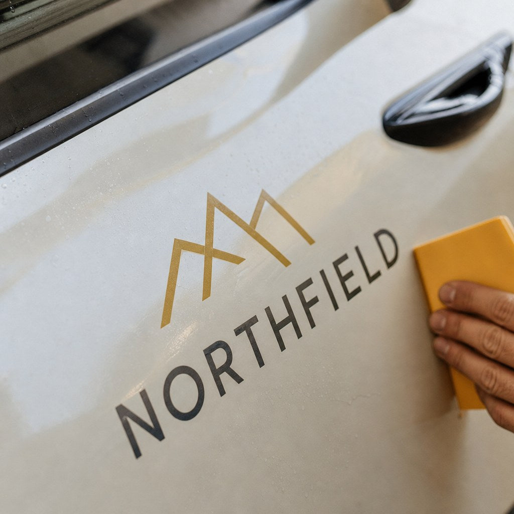 Car Decals – close-up: Close-up of cut vinyl lettering on car paint
